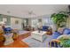 Spacious living room showcasing hardwood floors, natural light, and tastefully coordinated furnishings at 179 Ann Rustin S Dr, Ormond Beach, FL 32176