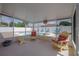 Screened patio showcasing outdoor seating and a view of the sparkling pool at 179 Ann Rustin S Dr, Ormond Beach, FL 32176