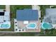 Aerial view showing a backyard oasis with a pool, brick patio, and landscaped yard, great for relaxation at 179 Ann Rustin S Dr, Ormond Beach, FL 32176