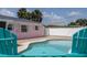 Outdoor pool with patio, lounge chairs, and view of the house at 179 Ann Rustin S Dr, Ormond Beach, FL 32176