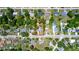 A birds-eye view shows the property in context with surrounding neighborhood and landscaping at 18 S Shell Rd, Debary, FL 32713