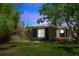 A home backyard with bamboo trees, a deck, and some greenery at 18 S Shell Rd, Debary, FL 32713