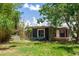 This cozy backyard is surrounded by bamboo trees, and has an inviting deck at 18 S Shell Rd, Debary, FL 32713