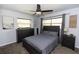 Cozy bedroom features a ceiling fan and lots of natural light coming in from the windows at 18 S Shell Rd, Debary, FL 32713