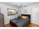Cozy bedroom features hardwood floors, neutral walls, and a ceiling fan for comfortable living at 18 S Shell Rd, Debary, FL 32713