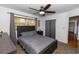 Bright bedroom features a ceiling fan and natural light streaming through the window at 18 S Shell Rd, Debary, FL 32713