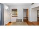 Bright dining area features hardwood floors and a glass paneled wooden door at 18 S Shell Rd, Debary, FL 32713
