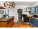 Open kitchen with stainless steel appliances, wooden countertops, pot rack, custom cabinets, and a breakfast nook at 18 S Shell Rd, Debary, FL 32713