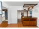 Open kitchen with view of a pot rack and island, creating a functional and inviting space for cooking and entertaining at 18 S Shell Rd, Debary, FL 32713