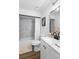 Bathroom featuring shower-tub combination with white tiled walls and a modern vanity at 185 Brookside Dr, Port Orange, FL 32128