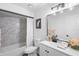 Bright bathroom featuring a shower-tub combination and a modern white vanity at 185 Brookside Dr, Port Orange, FL 32128
