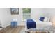 This bedroom offers natural light, with blue accents, and modern flooring at 185 Brookside Dr, Port Orange, FL 32128