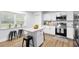 Updated kitchen with white cabinets, center island, and modern appliances at 185 Brookside Dr, Port Orange, FL 32128