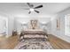 Inviting main bedroom boasts wood flooring, neutral palette, and comfortable design at 185 Brookside Dr, Port Orange, FL 32128