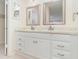 Bathroom featuring double sinks, granite countertops, bright lighting, and modern hardware at 1935 Conway Rd # A4, Orlando, FL 32812