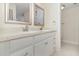 Bathroom featuring double sinks, granite countertops, bright lighting, and modern hardware at 1935 Conway Rd # A4, Orlando, FL 32812