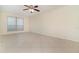 Bedroom with tile flooring, ceiling fan, and a large window allowing for ample natural light at 1935 Conway Rd # A4, Orlando, FL 32812