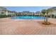 Inviting community pool with brick pavers and plenty of space to relax at 1935 Conway Rd # A4, Orlando, FL 32812