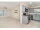 Updated kitchen featuring stainless steel appliances, granite counters and a view to the living room at 1935 Conway Rd # A4, Orlando, FL 32812