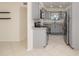 Updated kitchen featuring granite countertops, stainless steel appliances, and gray cabinets at 1935 Conway Rd # A4, Orlando, FL 32812