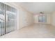 Bright living room features tile flooring, a ceiling fan and a door leading to the outside area at 1935 Conway Rd # A4, Orlando, FL 32812