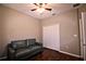 Bedroom with wood floors, a closet, and a loveseat at 201 Walter Stevens Way, Deland, FL 32724