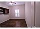 Bedroom features wood floors, shutters, and a built in cabinet at 201 Walter Stevens Way, Deland, FL 32724