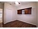 Bedroom features wood floors, closet, and a built in cabinet at 201 Walter Stevens Way, Deland, FL 32724