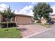 Beige home with a large garage, brick driveway, well maintained lawn, and mature trees at 201 Walter Stevens Way, Deland, FL 32724