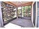 Spacious screened lanai with ceiling fan, offering a comfortable outdoor living space at 201 Walter Stevens Way, Deland, FL 32724