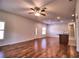 Bright living room with wood floors, recessed lighting, an open layout, and a ceiling fan at 201 Walter Stevens Way, Deland, FL 32724