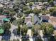 Aerial view of home with driveway and mature trees at 202 W Chancery Ln, Deland, FL 32724