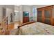 Cozy bedroom featuring hardwood floors and a view of the bathroom at 202 W Chancery Ln, Deland, FL 32724
