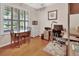 Bedroom with a desk, dark wood floors, a ceiling fan and a window with shutters at 202 W Chancery Ln, Deland, FL 32724