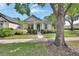 Exterior view of the home featuring manicured landscaping at 202 W Chancery Ln, Deland, FL 32724