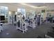 Bright gym with multiple exercise machines, neutral paint, large windows, and carpeted floor at 202 W Chancery Ln, Deland, FL 32724