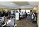 Spacious gym with modern fitness equipment, large mirrors, ceiling fans, and televisions at 202 W Chancery Ln, Deland, FL 32724