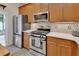 Beautiful kitchen featuring stainless steel appliances and cabinetry at 202 W Chancery Ln, Deland, FL 32724