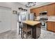 Well-appointed kitchen featuring a butcher block island, stainless steel appliances, and stylish tile flooring at 202 W Chancery Ln, Deland, FL 32724