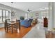 Bright and open living area with comfortable seating, a dining space, and ample natural light at 202 W Chancery Ln, Deland, FL 32724