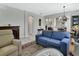 Open-concept living space with fireplace, stylish furniture, flowing into dining room, and a tranquil atmosphere at 202 W Chancery Ln, Deland, FL 32724