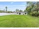 Large backyard features a lush green lawn and a white fence for privacy at 2127 3Rd Ave, Deland, FL 32724