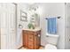 Updated bathroom with modern vanity, toilet, fixtures and lighting at 2127 3Rd Ave, Deland, FL 32724