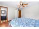 Cozy bedroom with wood flooring, and access to an en-suite bathroom at 2127 3Rd Ave, Deland, FL 32724