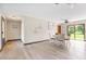 Bright dining area with a modern ceiling fan and sliding glass doors to backyard at 2127 3Rd Ave, Deland, FL 32724