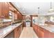 Well-equipped kitchen with wood cabinets, a central island, and stainless steel appliances at 2127 3Rd Ave, Deland, FL 32724