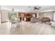 Spacious open concept living room and kitchen with neutral walls and wood-look flooring at 2127 3Rd Ave, Deland, FL 32724