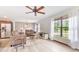 Cozy living room featuring neutral tones, large windows, and a ceiling fan for comfortable living at 2127 3Rd Ave, Deland, FL 32724