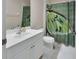 Clean bathroom with white vanity and stylish shower curtain at 217 Lourdan Ct, Debary, FL 32713