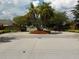 Lakeside community entrance features brick pillars, iron gates, and well-maintained landscaping at 217 Lourdan Ct, Debary, FL 32713